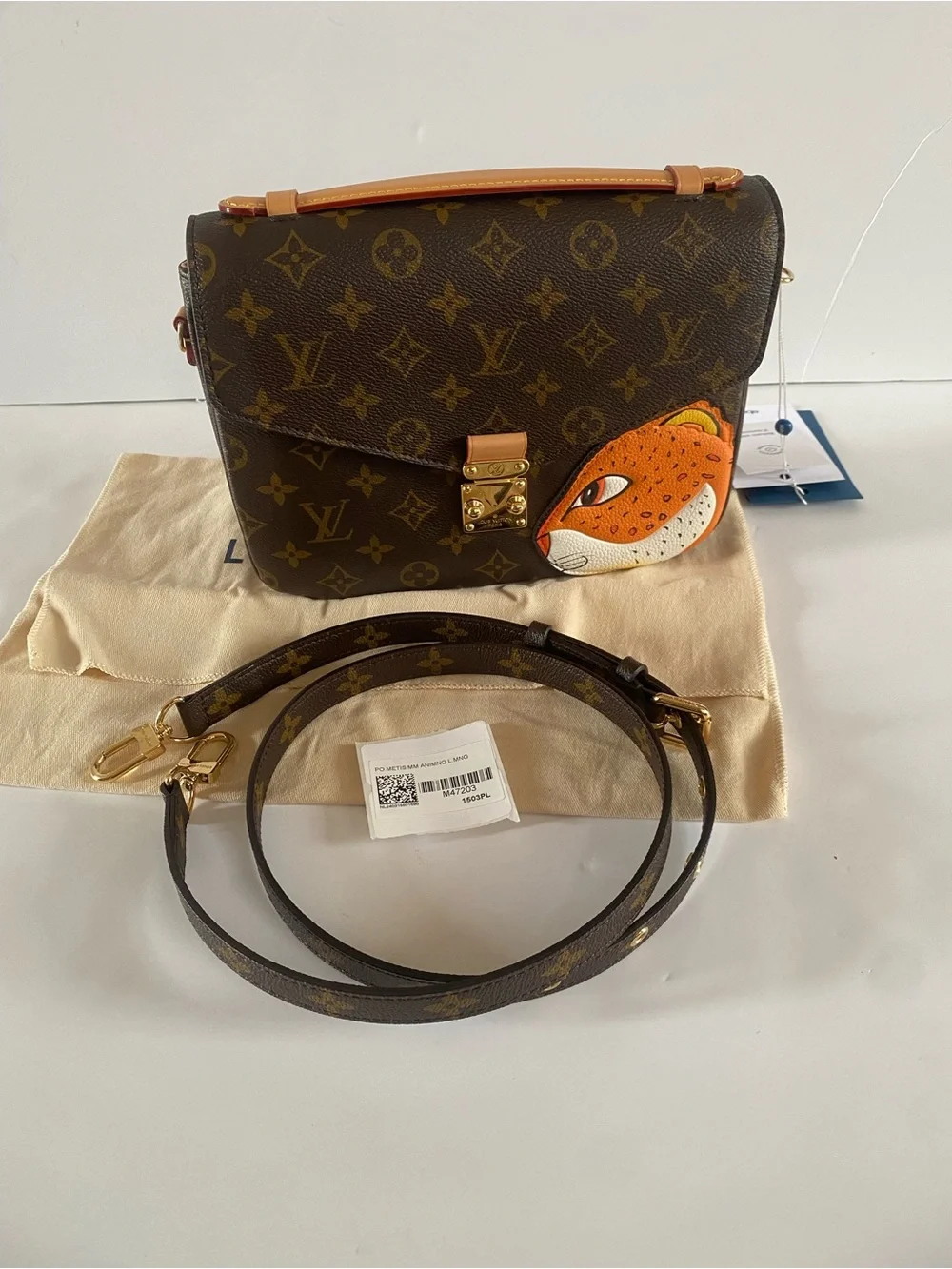 Louis Vuitton pochette Metis (tiger face)